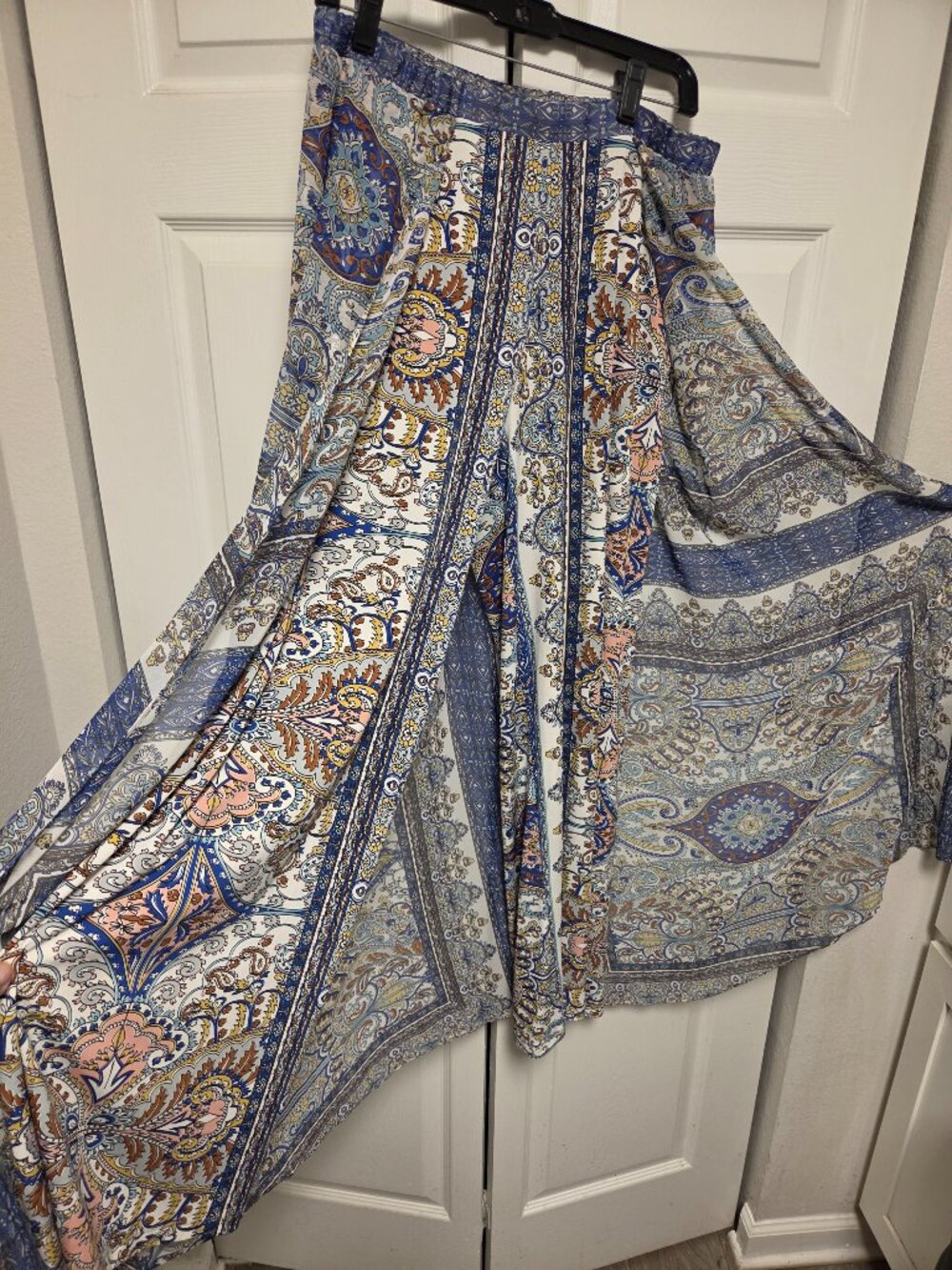 Pants with an attached skirt overlay.